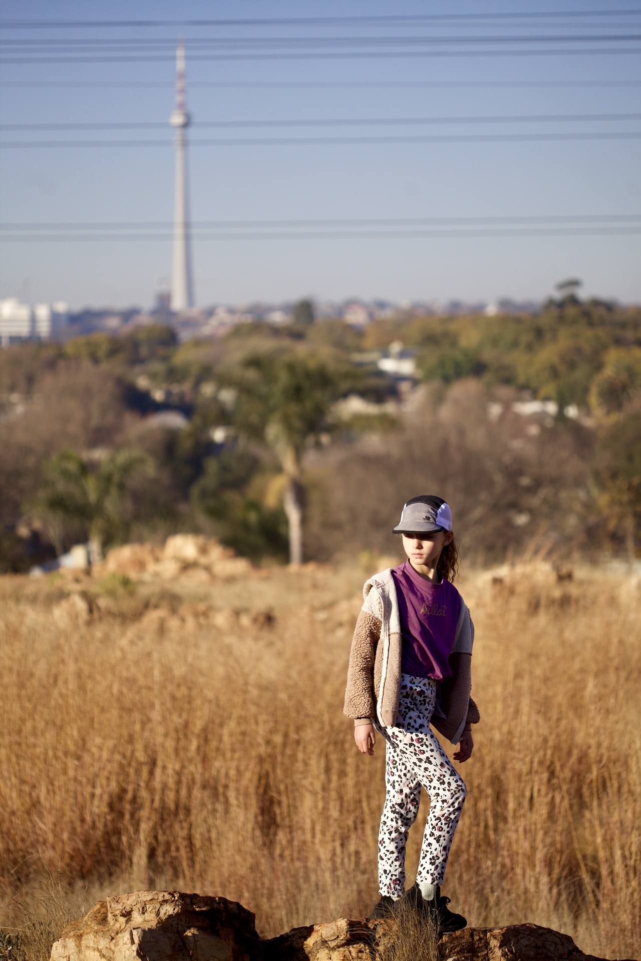 Cool kids in the fields around Johannesburg wearing a trail caps in grey / black